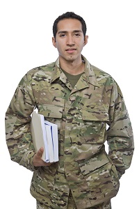 Image of Male Service Member with school books